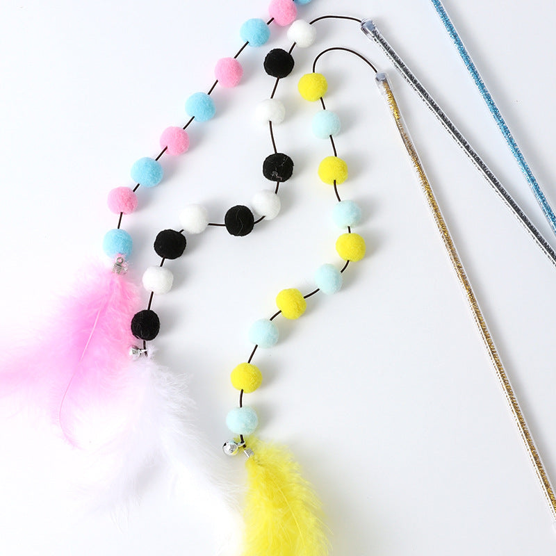 Bâton à pompons en laine multicolore avec plume — Maison Abba